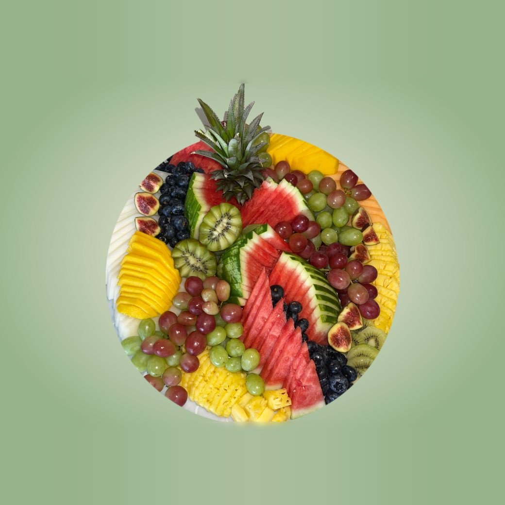 Round fruit platter with pineapple crown